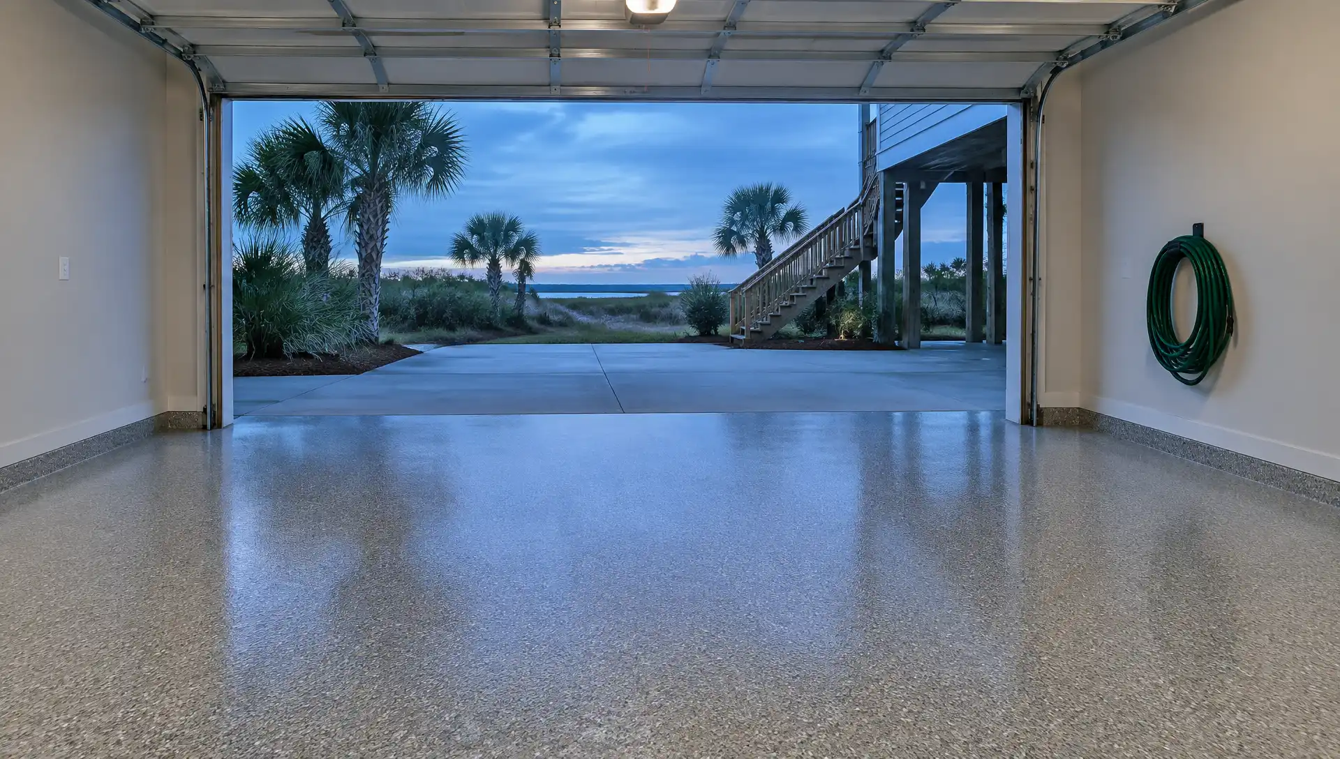 Epoxy floor installation in Myrtle Beach, SC: finished gray flake floor in a ground-level garage of a coastal home