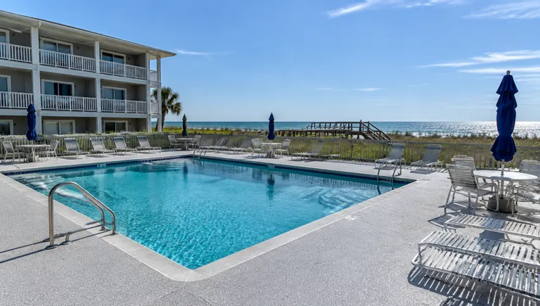 Epoxy flooring in Garden City, SC: textured pool deck coating at a low-rise beach condo
