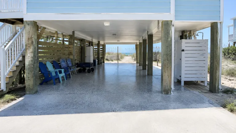Epoxy flooring in Surfside Beach, SC: gray flake floor under a raised beach house