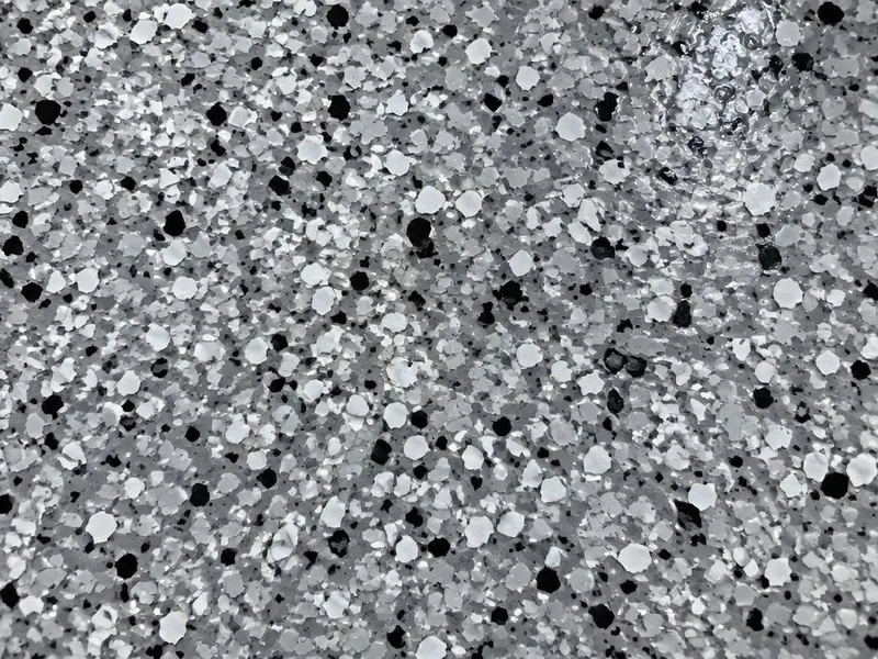 Close-up of a gray, white and black flake epoxy floor in Myrtle Beach, SC