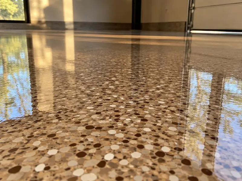 Clear polyaspartic coating over a tan flake floor in Myrtle Beach, SC