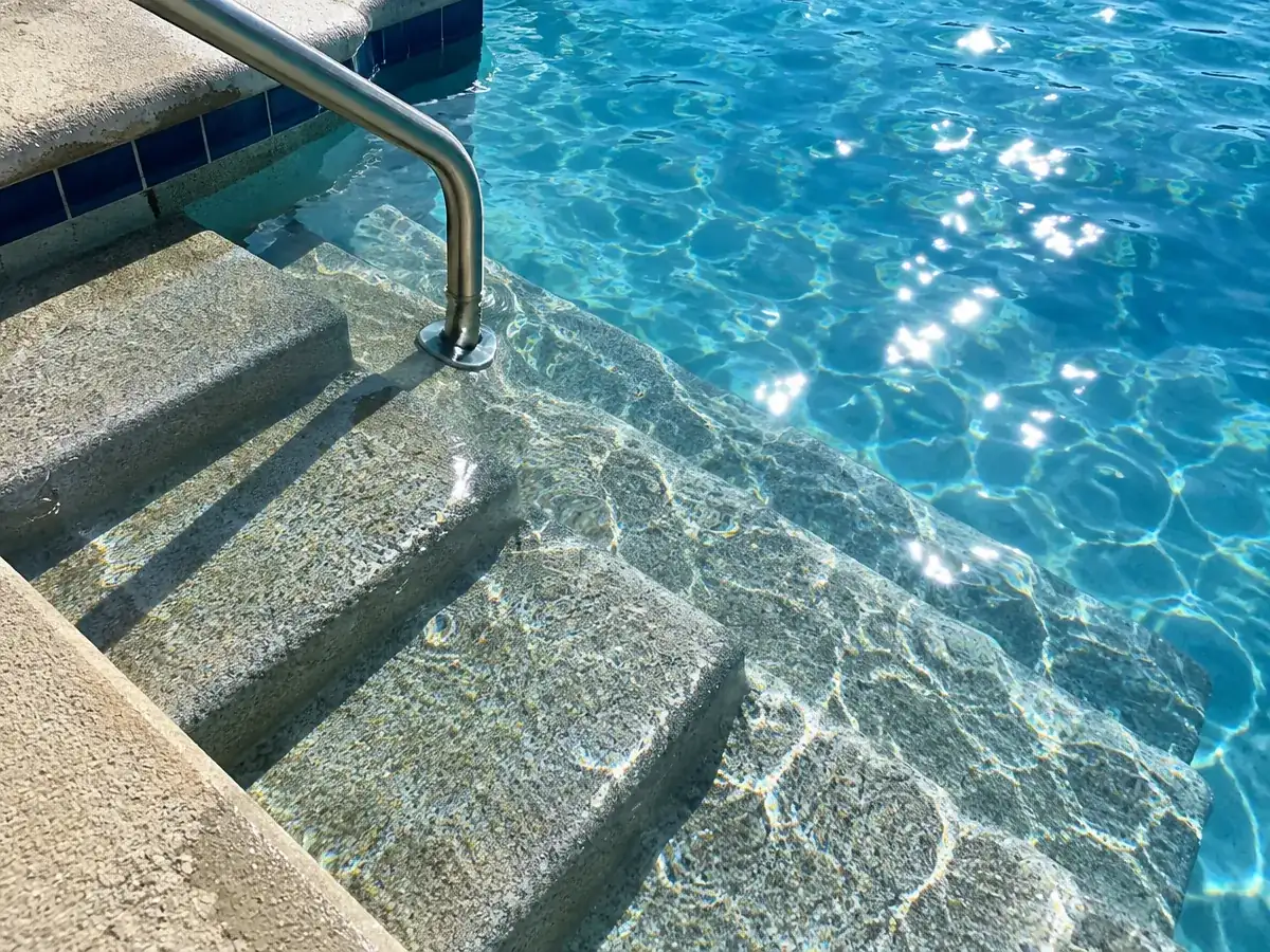 Slip-resistant pool deck coating on wet pool steps in Myrtle Beach, SC